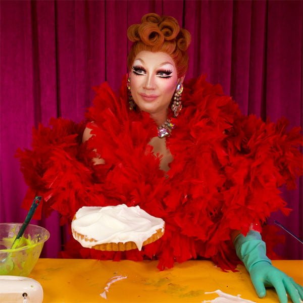 Ginger's artistic expression Drag performer Ginger Johnson in full makeup and elaborate outfit during Soho show