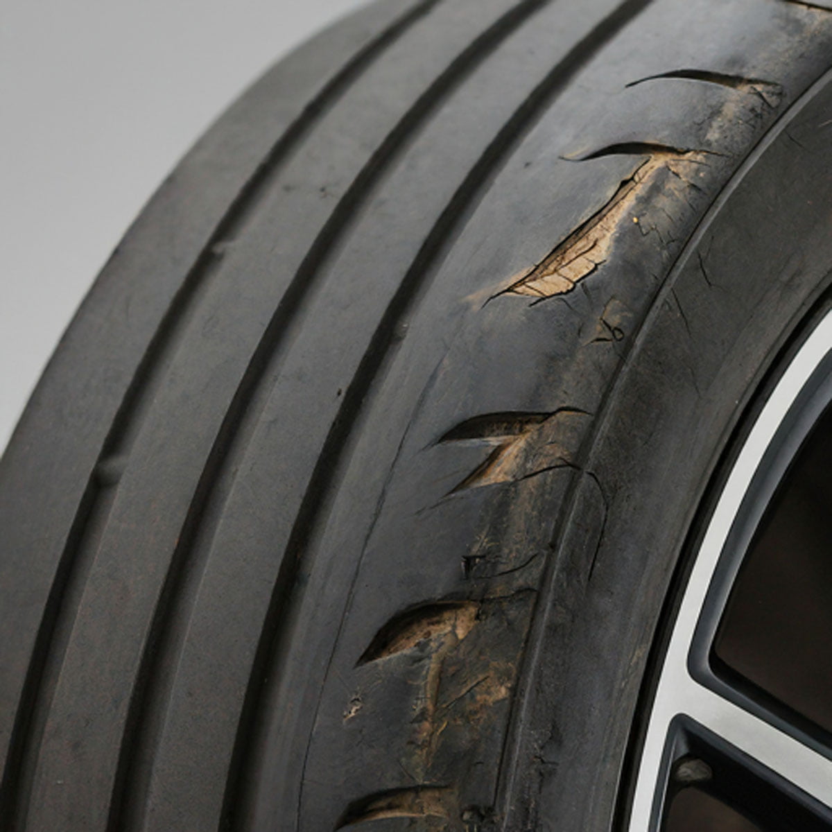Car undercarriage showing wheel alignment angles and suspension components