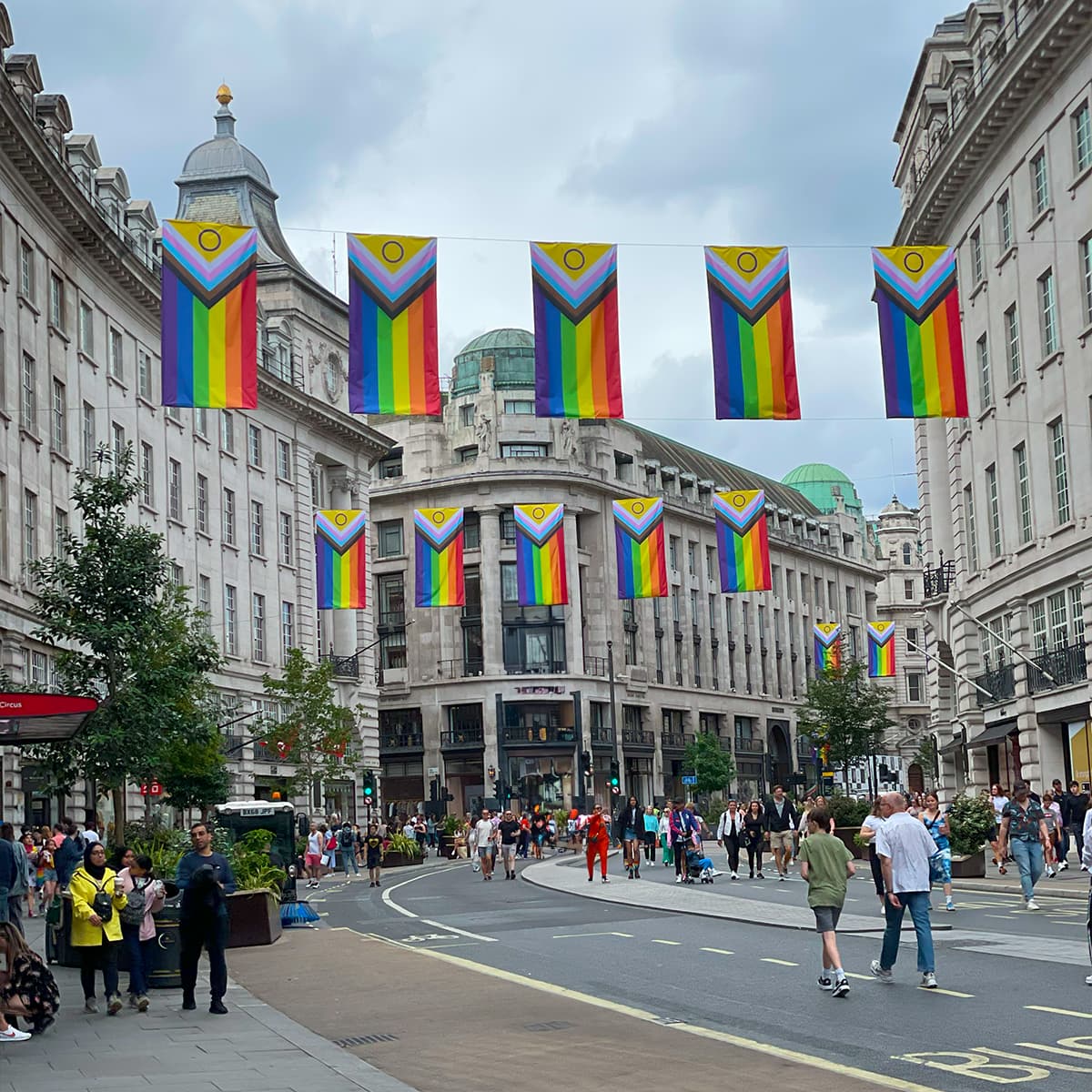 Community participation moment LGBTQ+ community members gathered together during Pride in London festivities