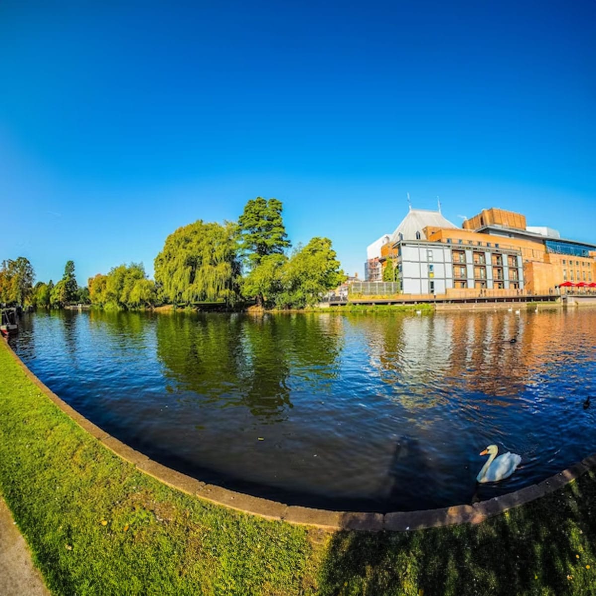 Picturesque Tudor-style timber-framed buildings lining historic street in Stratford-upon-Avon
