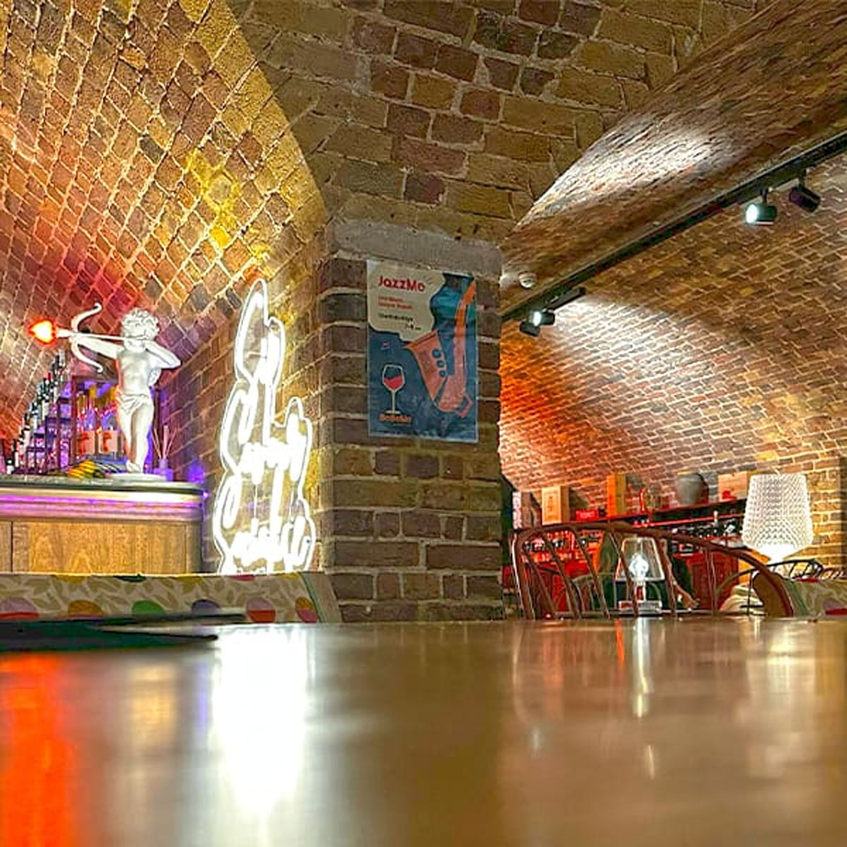 Cosy basement dining space Relaxed basement dining area at Mercato Mayfair with ambient lighting and comfortable seating