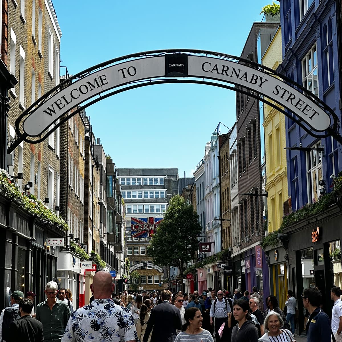 Famous Soho shopping street Carnaby Street in Soho lined with colourful shops and historic buildings