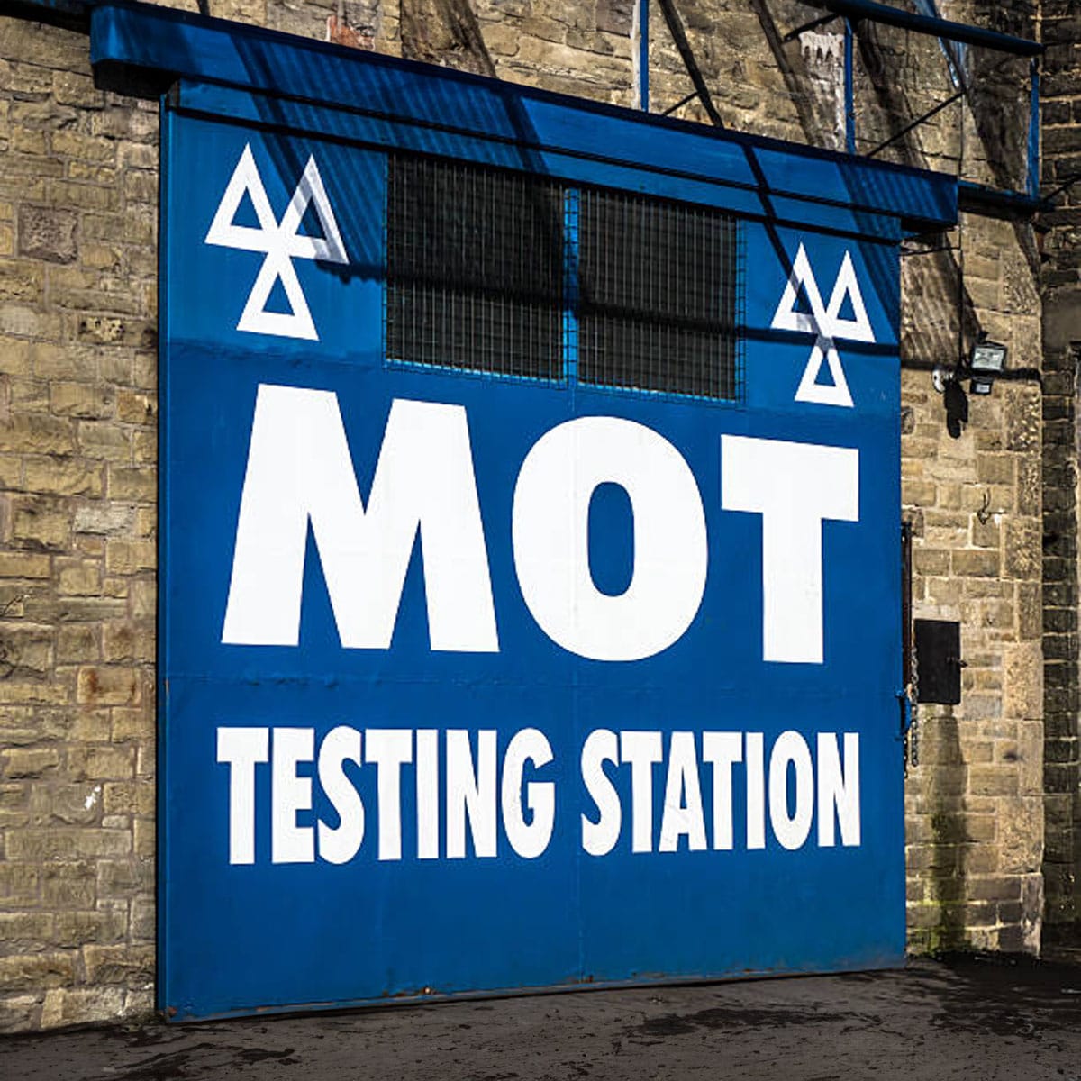 Tyre condition assessment Close-up view of car tyre tread depth measurement for MOT compliance