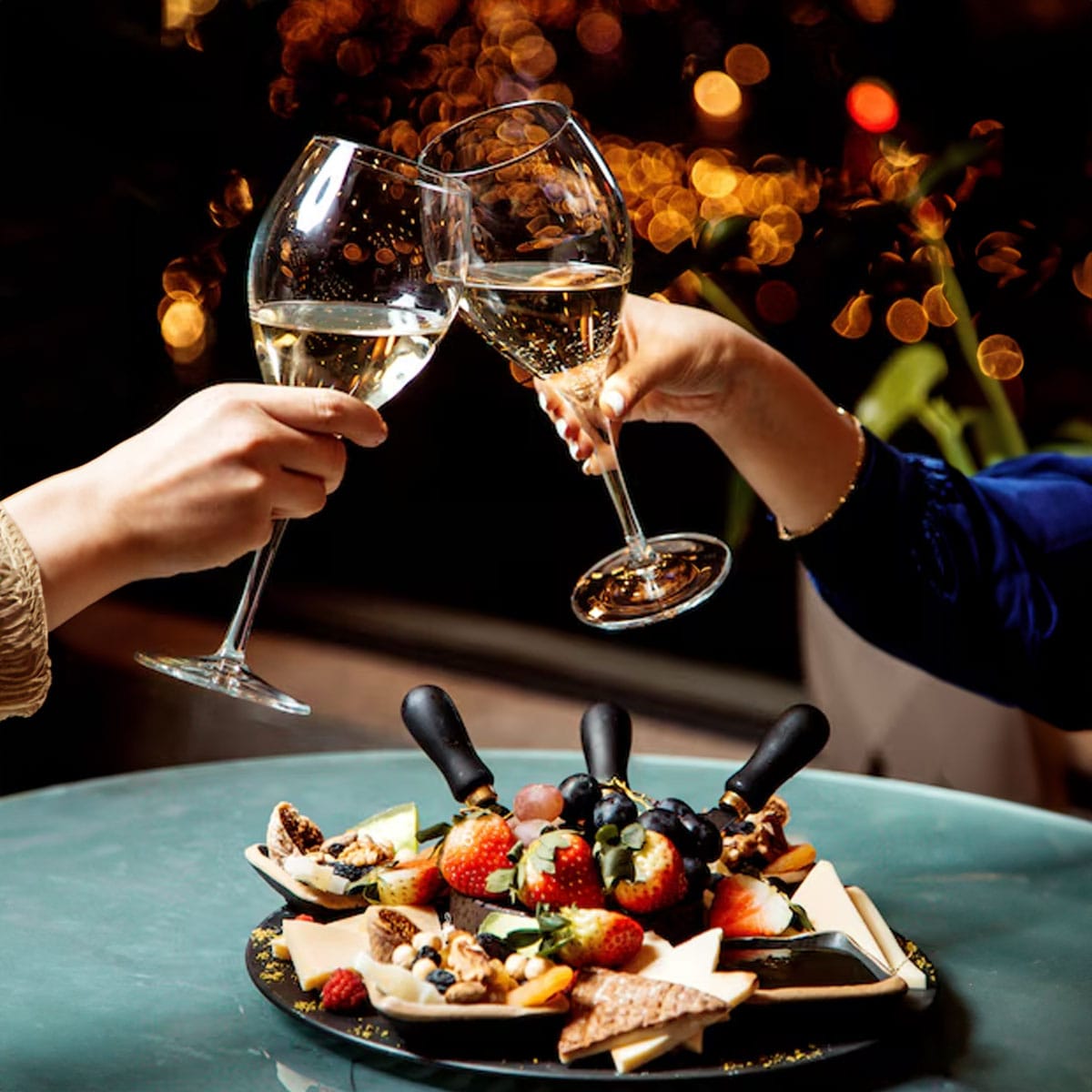 Sparkling wine being poured into a glass at a wedding reception celebration