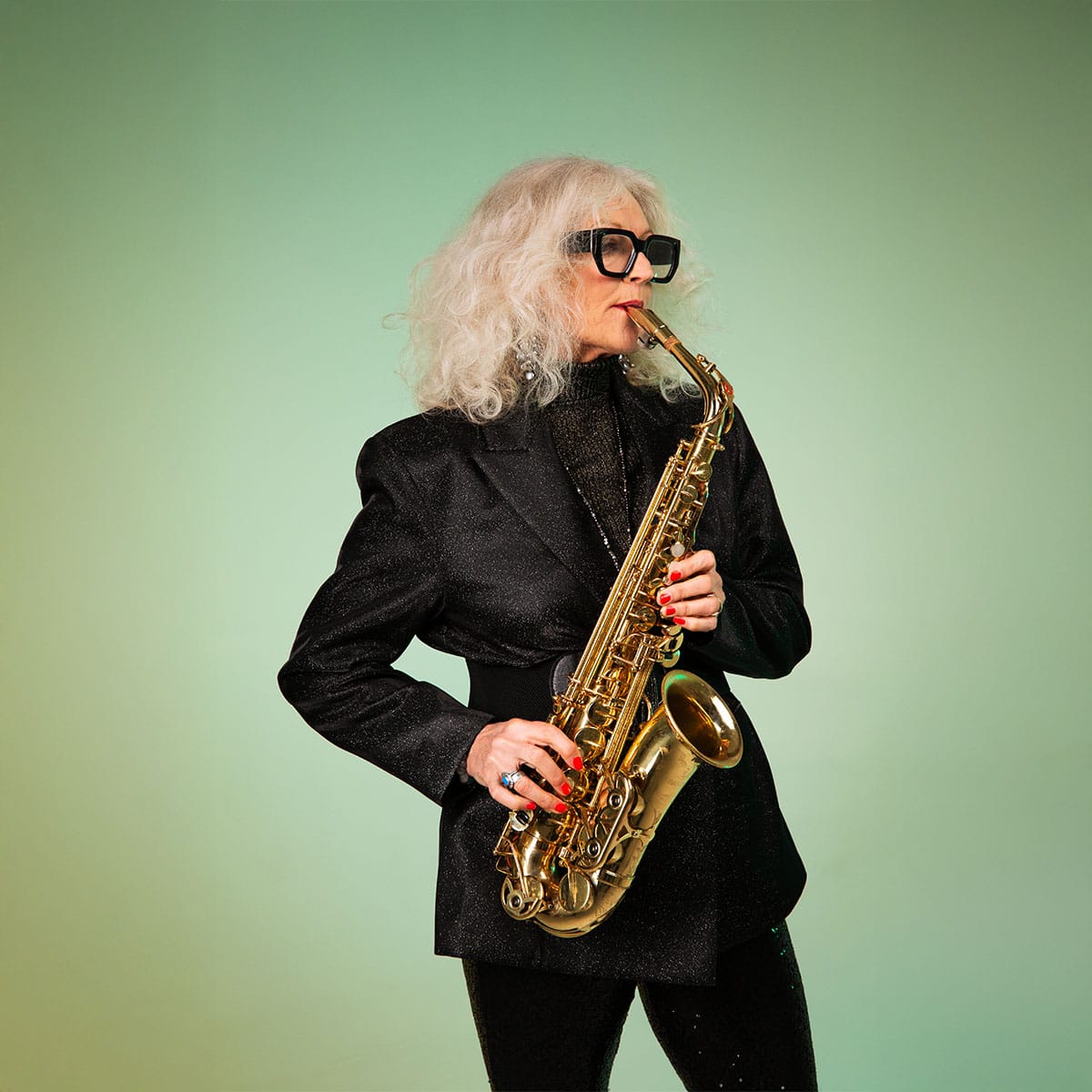 Anita's expressive saxophone performance Anita Carmichael performing with saxophone, demonstrating her signature sax soul diva artistry