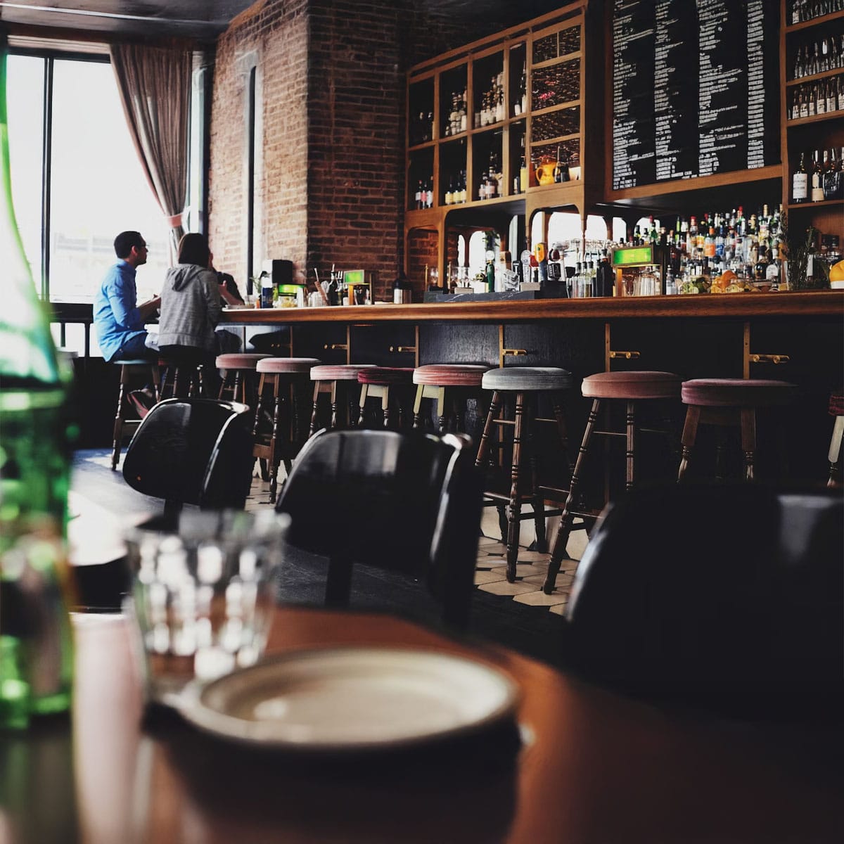 LGBTQ+ community members celebrating pride at Soho's inclusive pub crawl venue