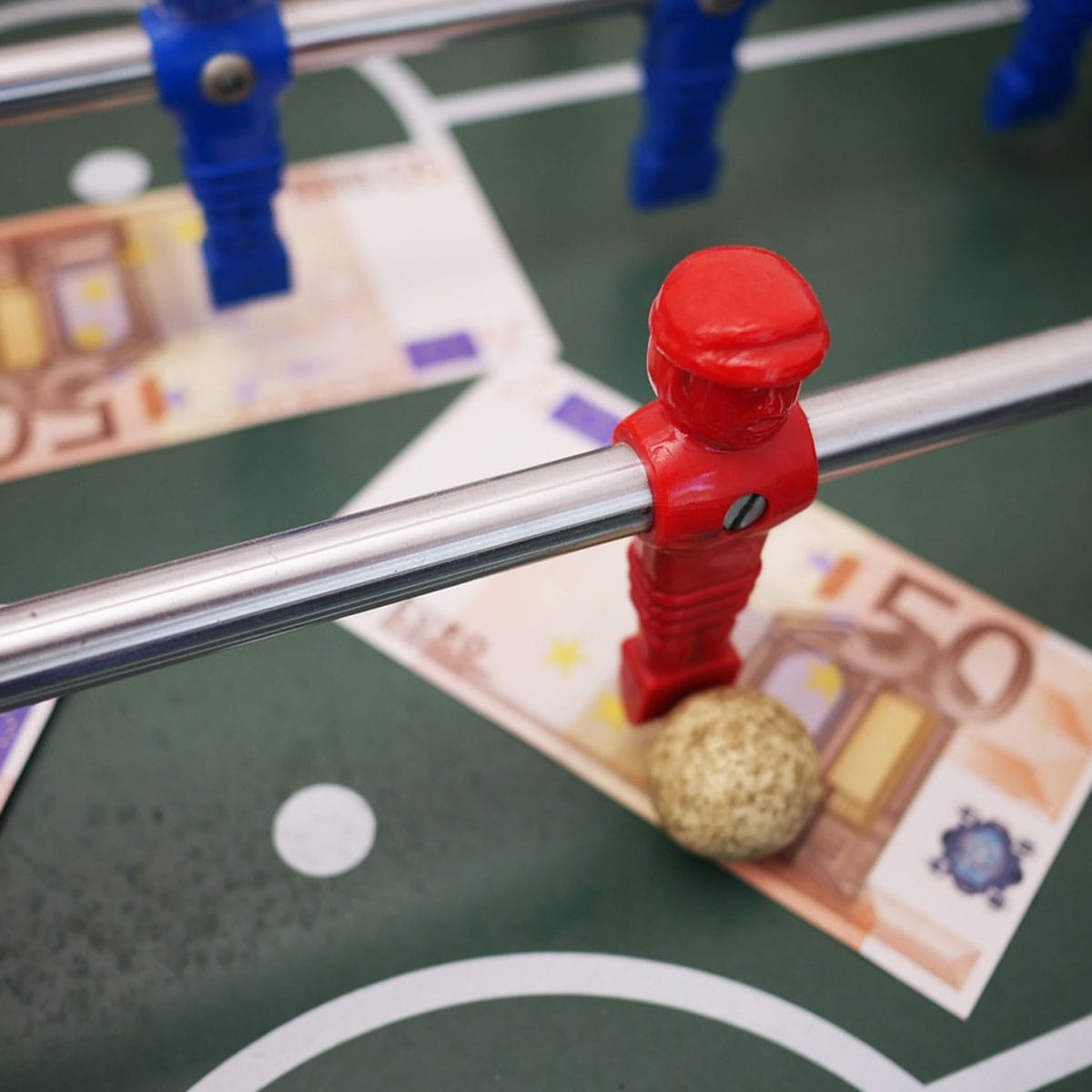Irish bettor placing in-play stake on mobile device during live sporting event