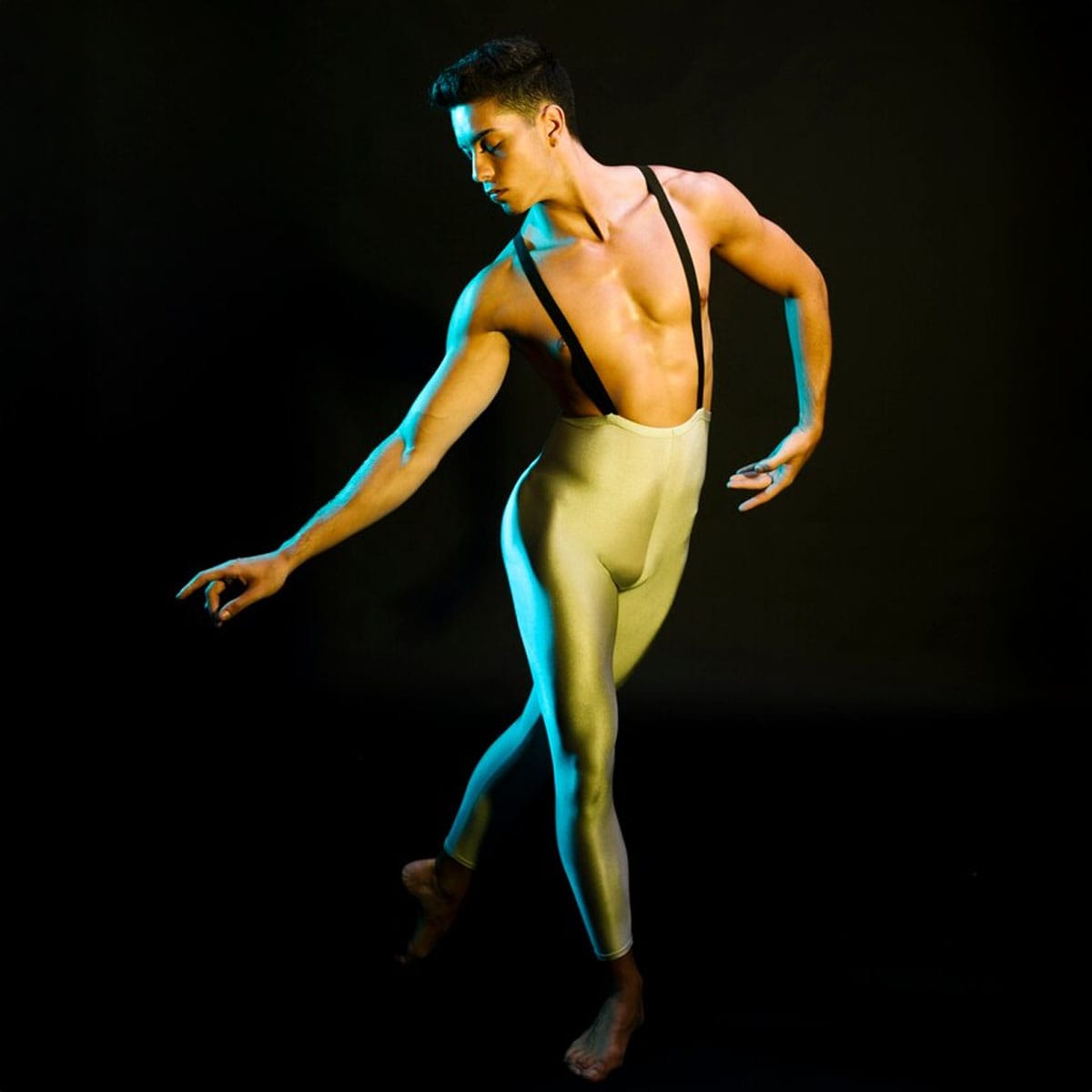 Male go-go dancer performing on stage during Soho nightlife show