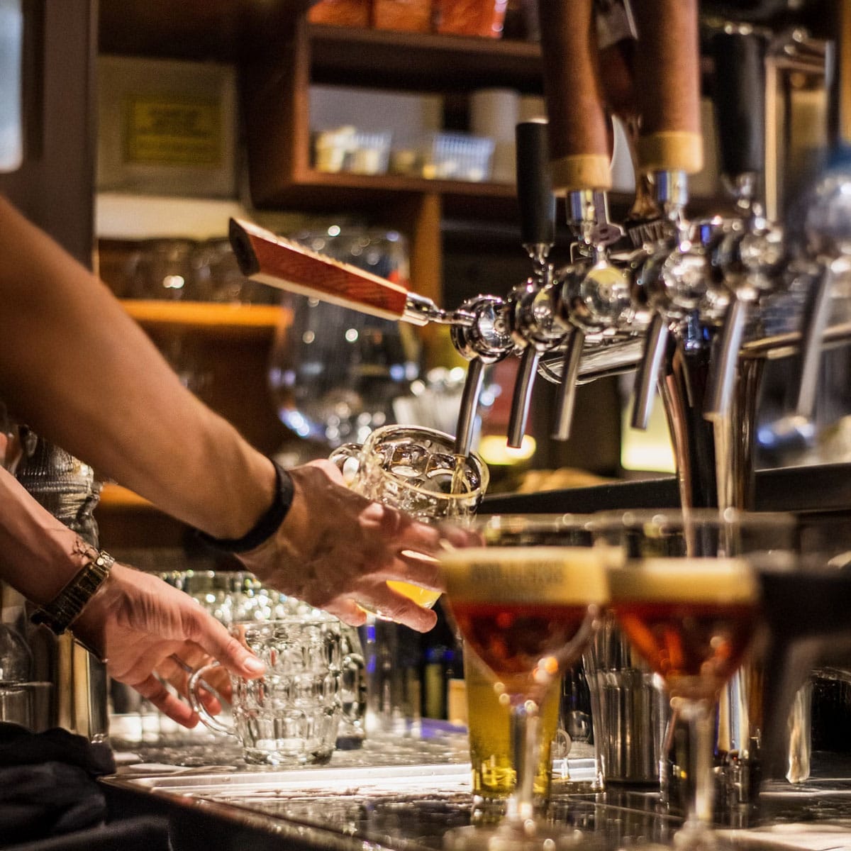 Soho pub crawl participants enjoying themed night event with pub passport keepsakes