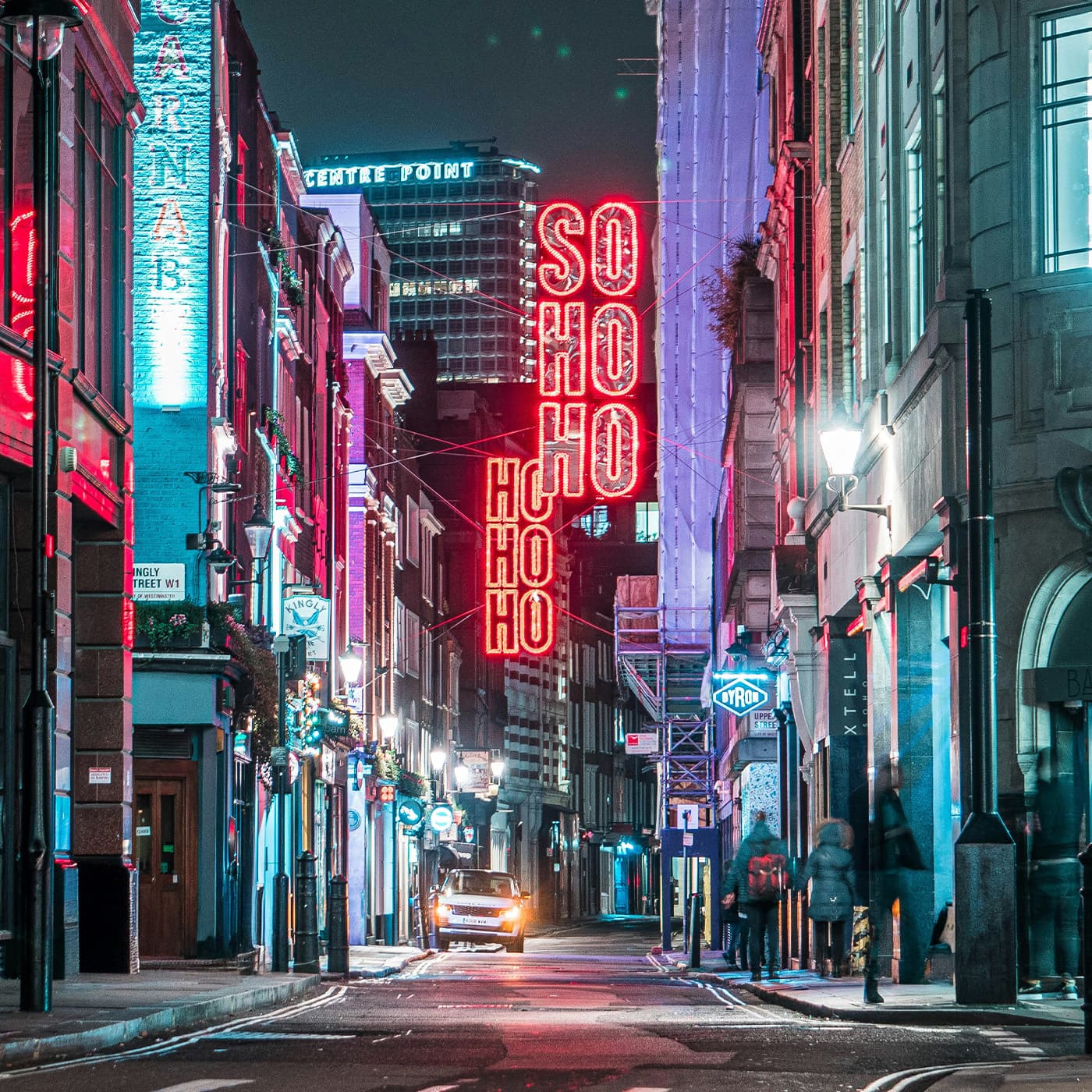 Soho's iconic street culture Vibrant Soho street scene with bustling cafés, bars, and pedestrians enjoying the district's lively atmosphere