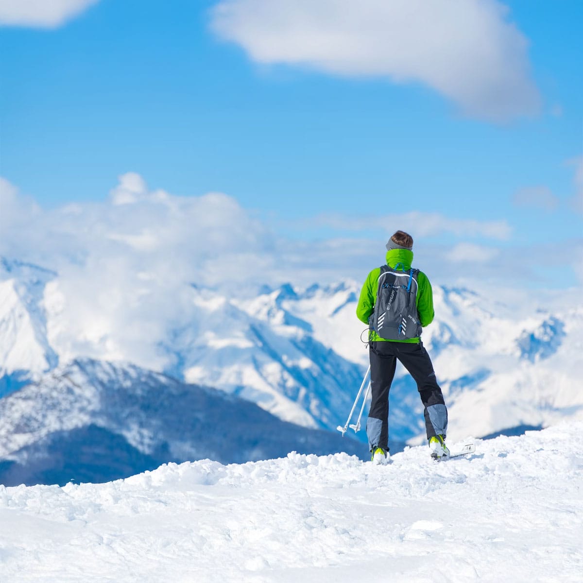 Lively après-ski bar scene with guests enjoying drinks and socialising in mountain setting