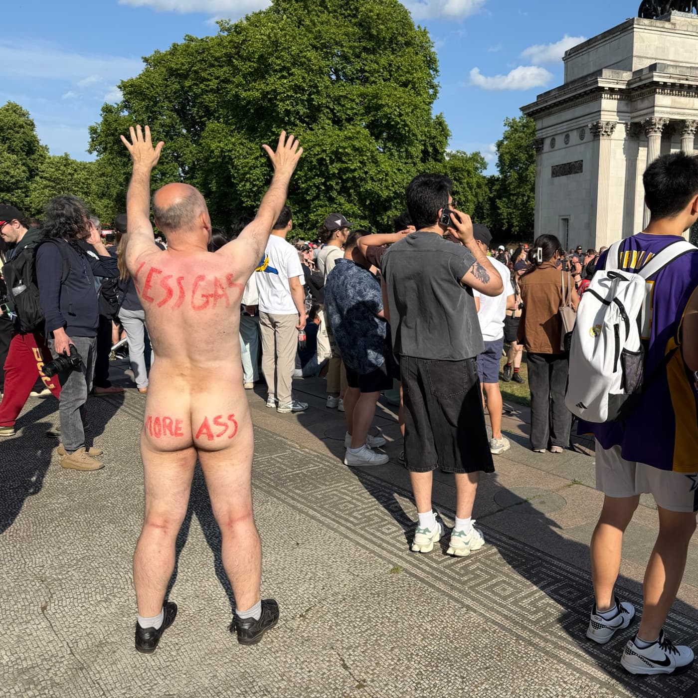 Environmental message on skin Activist displaying environmental slogan on body during London naked bike ride