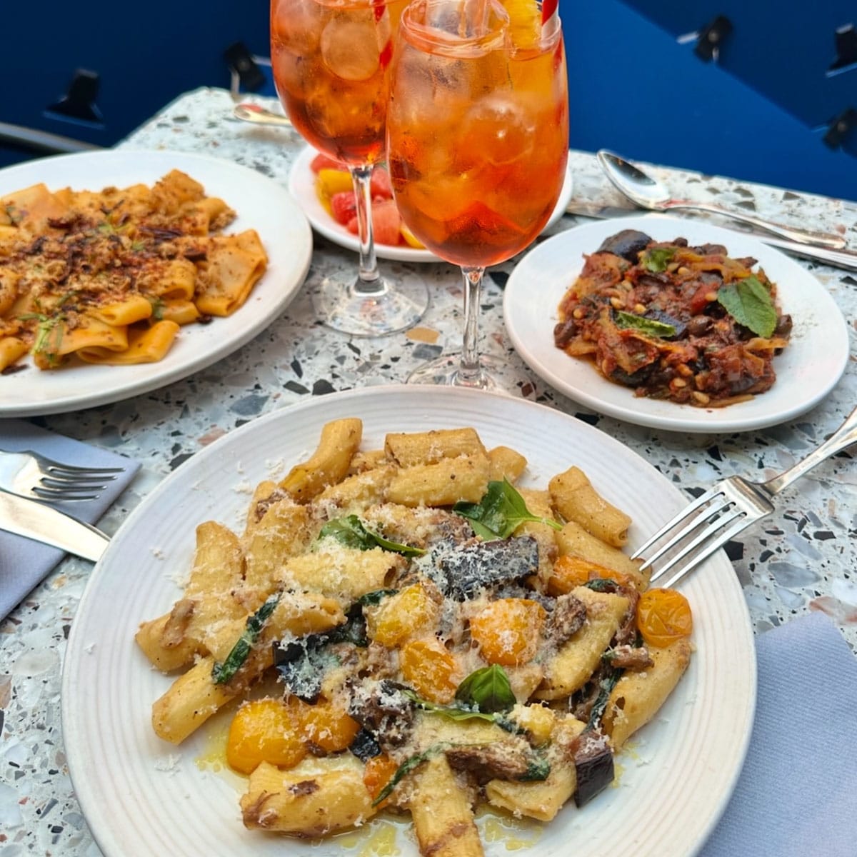 Crispy fried pasta dish with melted cheese, nduja and honey drizzle