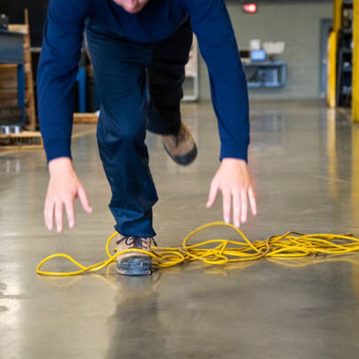 Worker wearing protective equipment handling hazardous chemicals safely