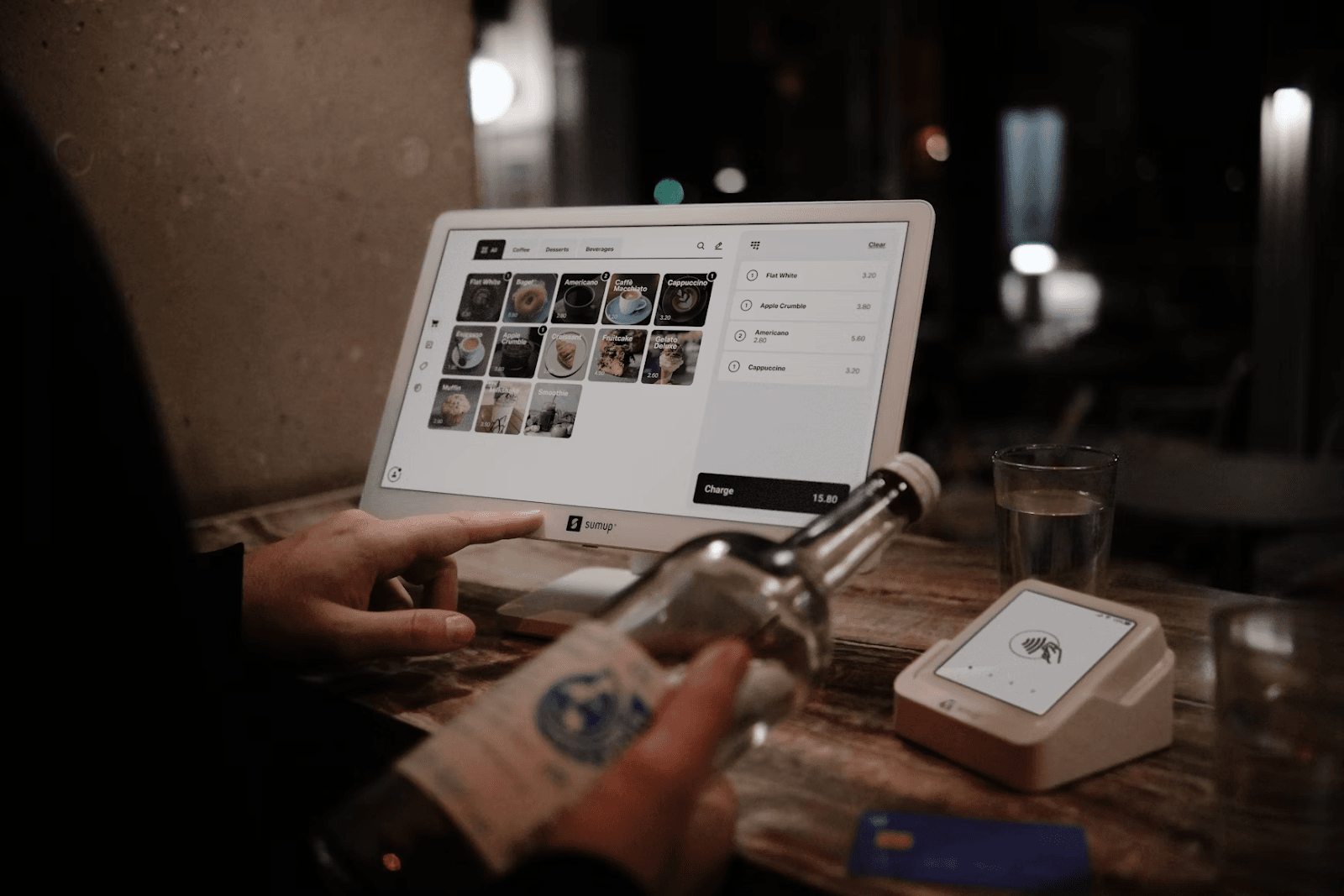 Payment processing solutions Digital payment terminal displaying contactless payment options for hospitality venues