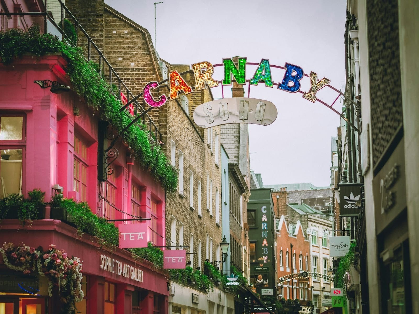 Vibrant Soho street scene showcasing eclectic shops, galleries, and bustling nightlife energy
