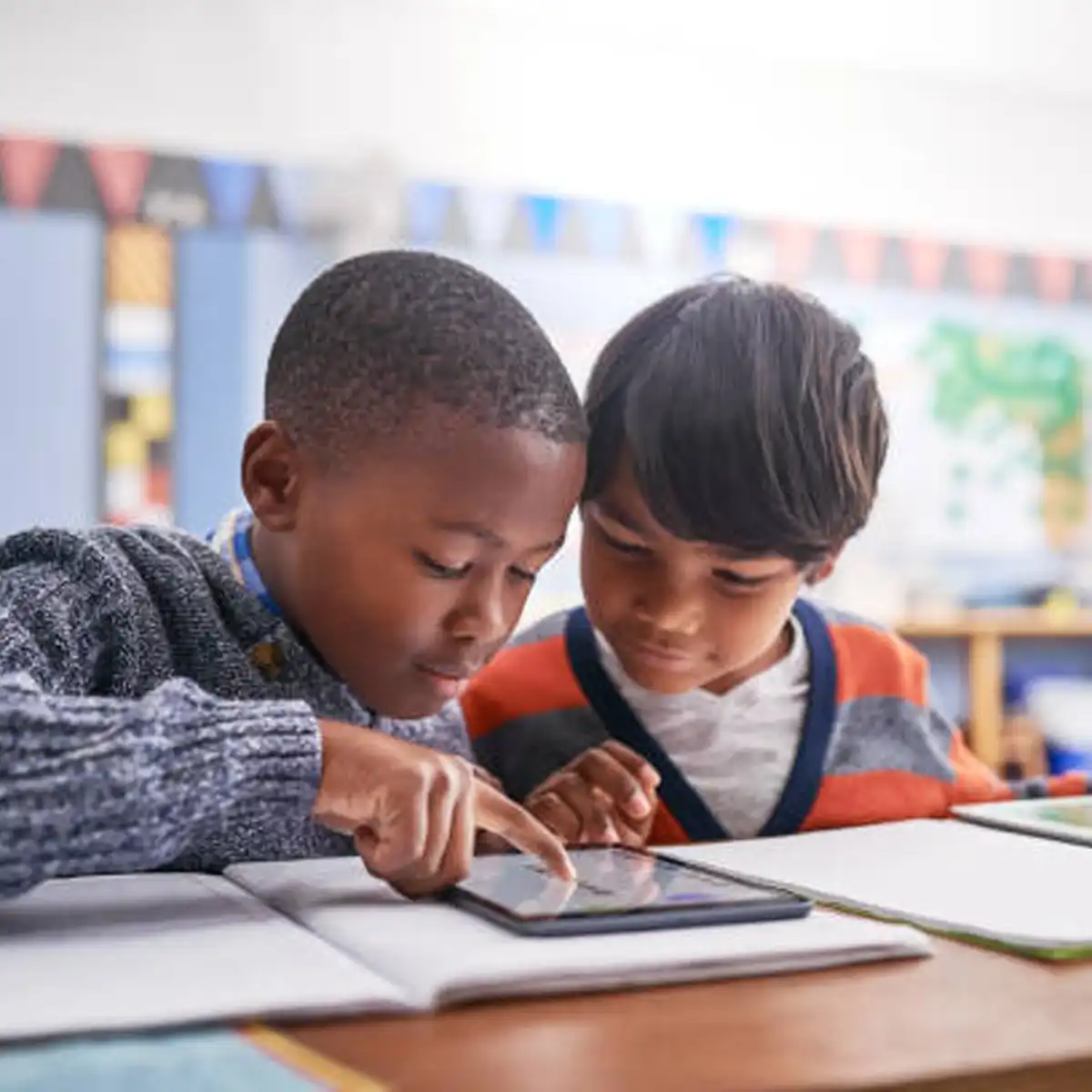 Children engaged in collaborative learning activities developing social and emotional skills
