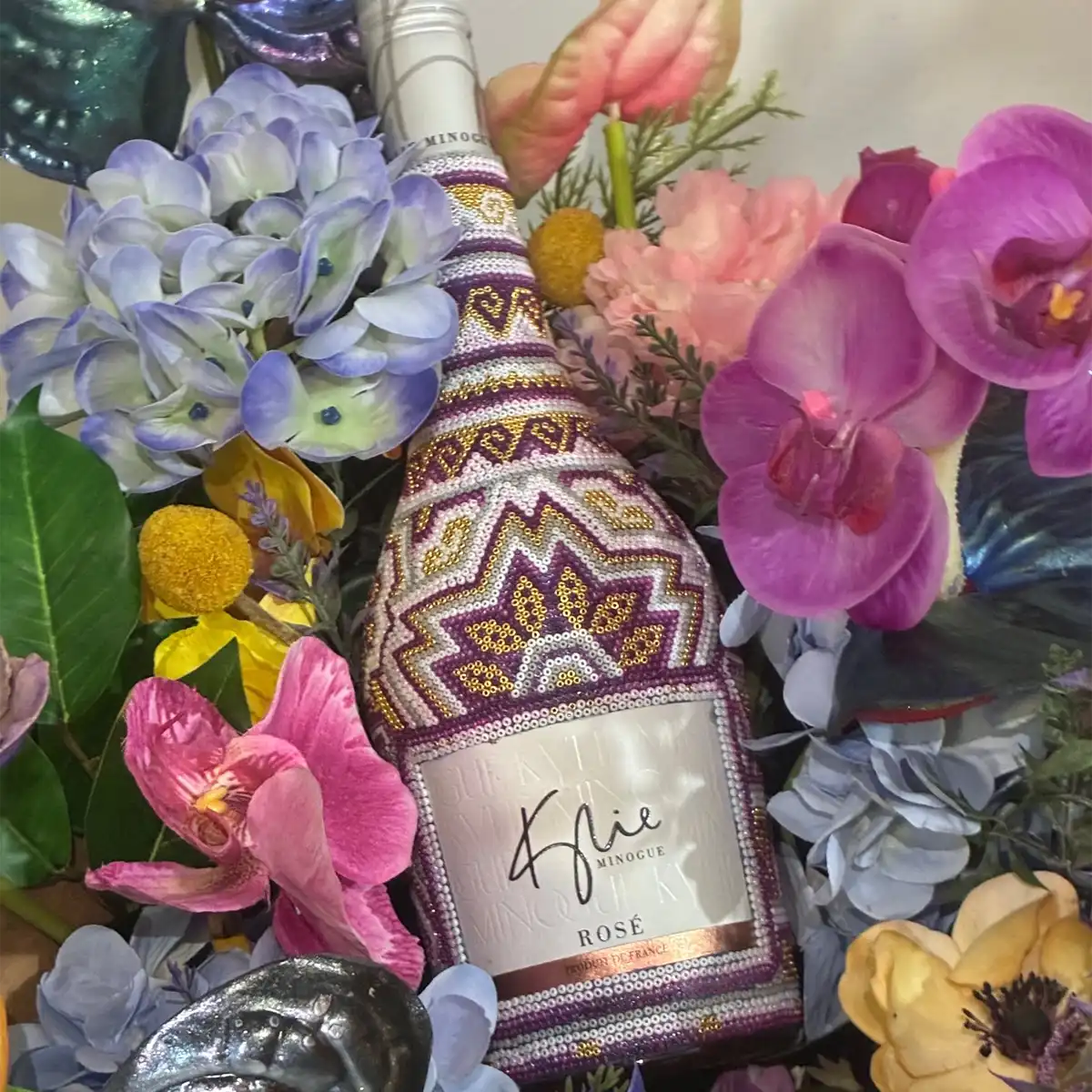 Prosecco Rosé bottle display Kylie Minogue Wines Prosecco Rosé bottle with pink label and branding