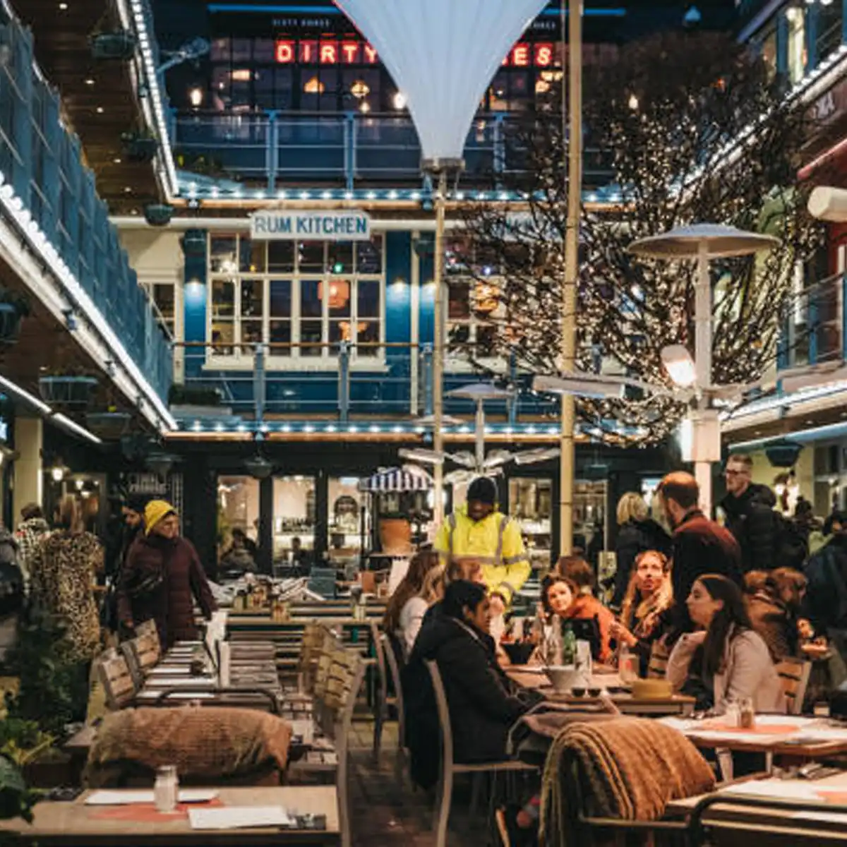 Busy Soho street scene with creative professionals and shoppers moving through the district