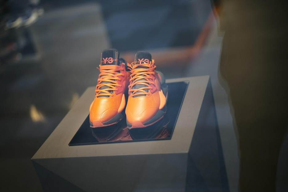 Authenticating shoe construction details Close-up inspection of shoe stitching and materials for counterfeit detection