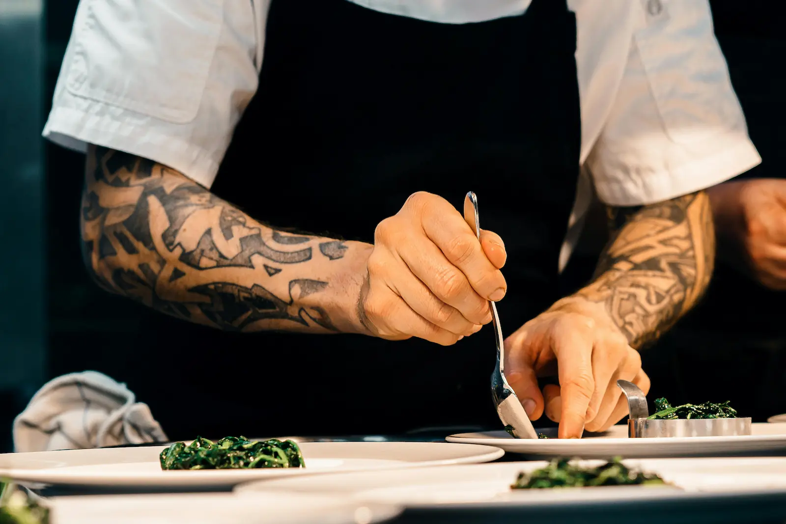 Chef preparing Greek cuisine Professional chef Christos Fotos preparing creative Greek-inspired dishes at Jul's