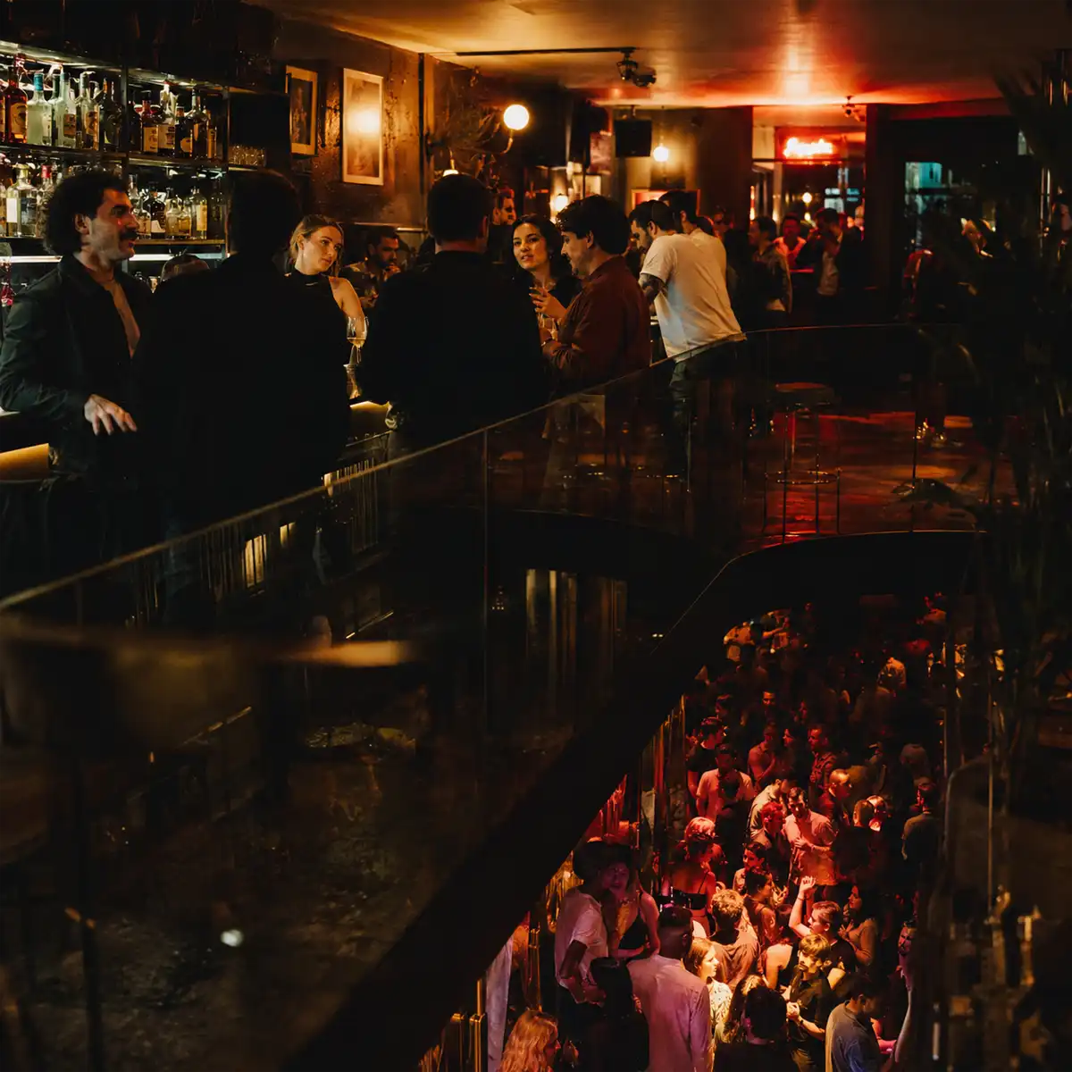 Vibrant late licence bars in Soho with patrons enjoying cocktails and entertainment past 2am on bustling Wardour Street