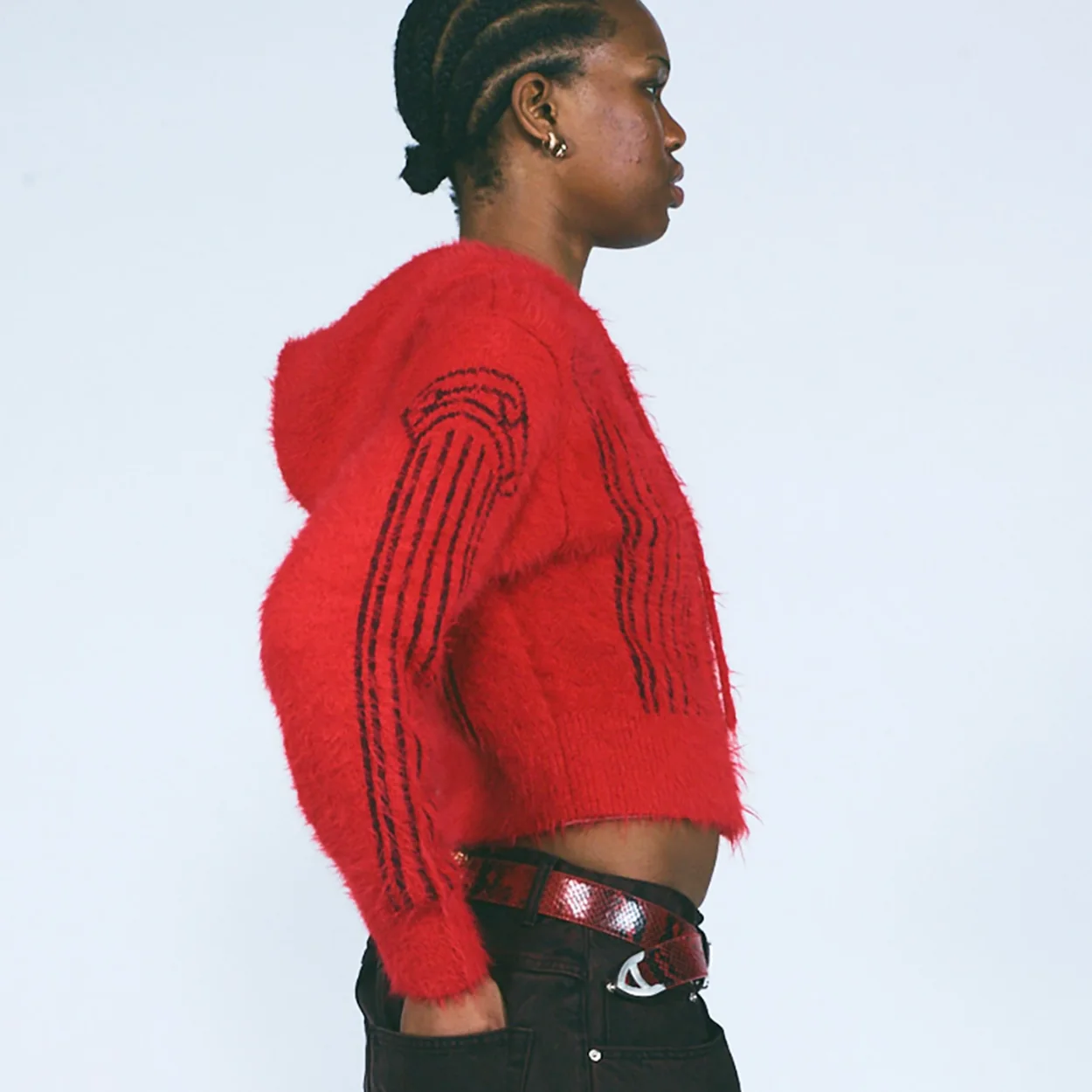 Red mohair Aries jumper photographed in profile for the label's collection