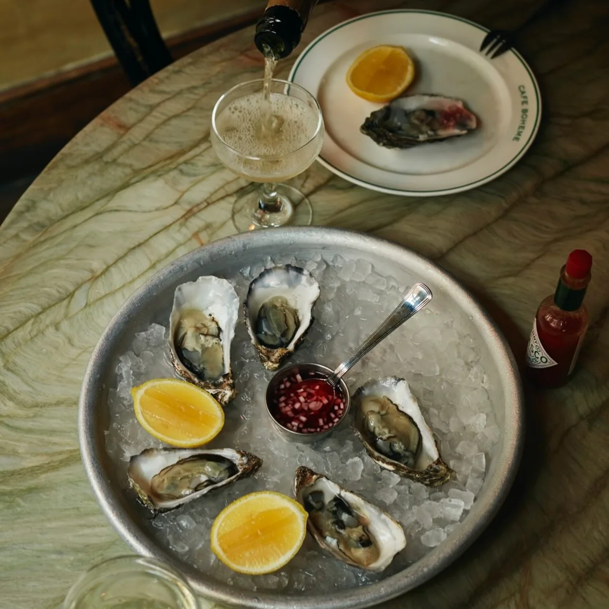 Oysters on ice with lemon and mignonette at Cafe Boheme in Soho