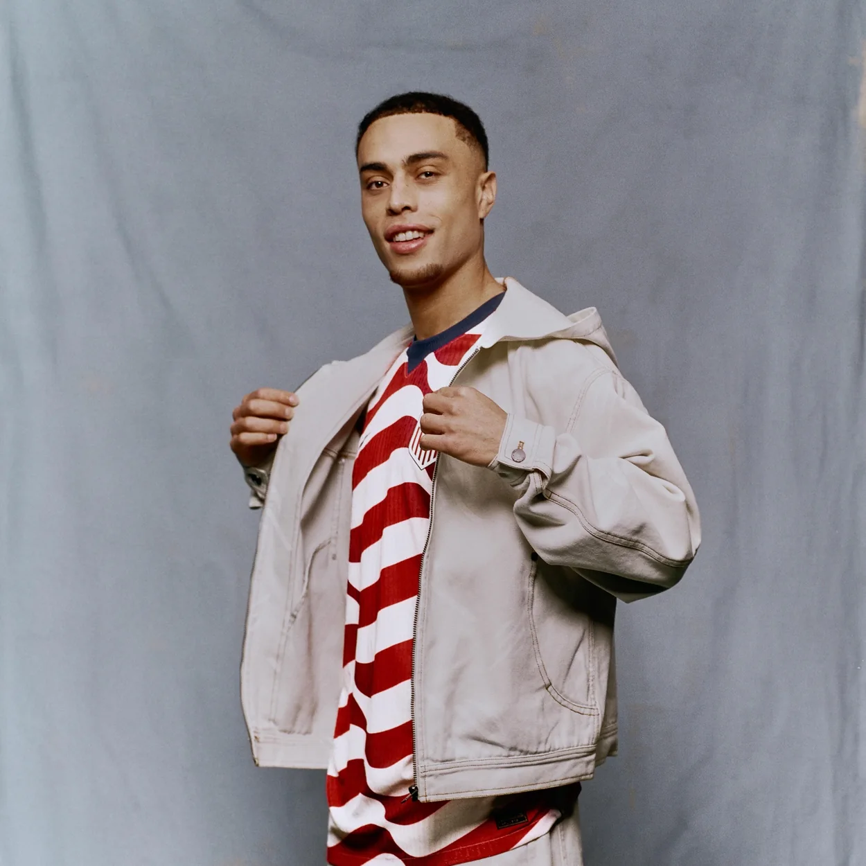 Daily Paper lookbook outfit with striped tee and cream jacket from the seasonal range