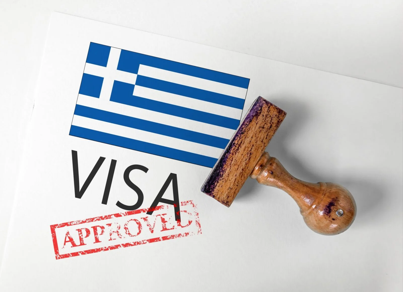 Greek flag on a visa document stamped approved, representing a Greece Golden Visa residence permit