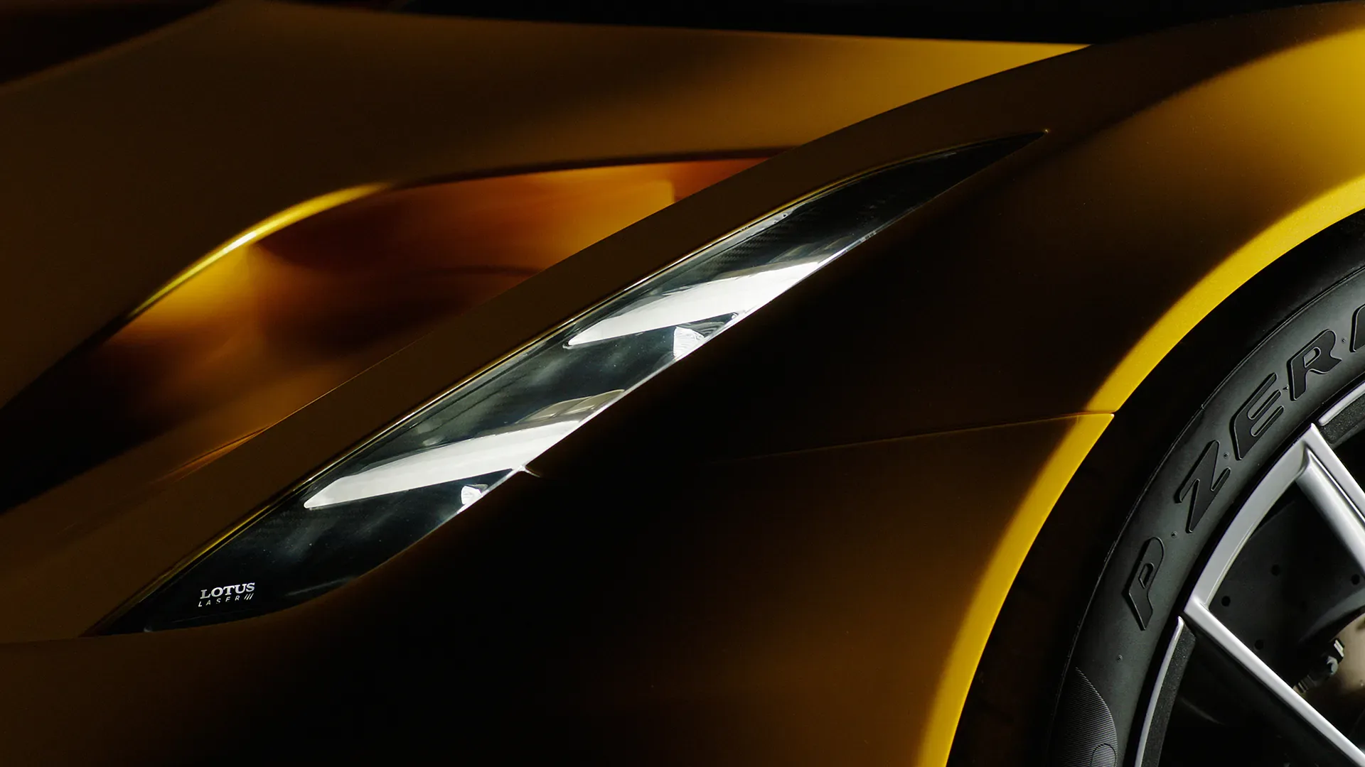 Close-up of a yellow Lotus sports car headlight from a Lambda Films automotive commercial shoot