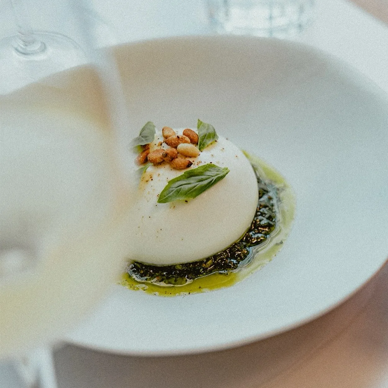 Panna cotta with basil oil and pine nuts at Lina Stores in Soho