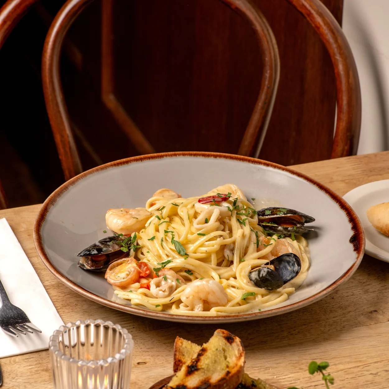 Seafood linguine with mussels served with toasted bread at Prix Fixe in Soho