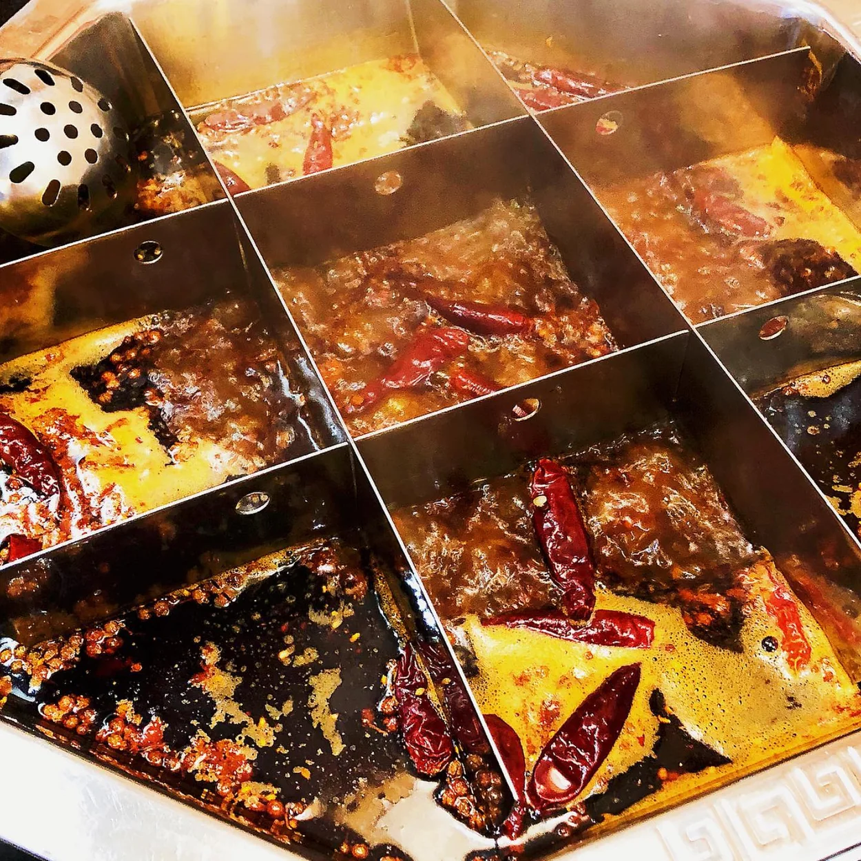 Nine-grid Sichuan broth bubbling with chillies at Shu Xiang Ge in Chinatown