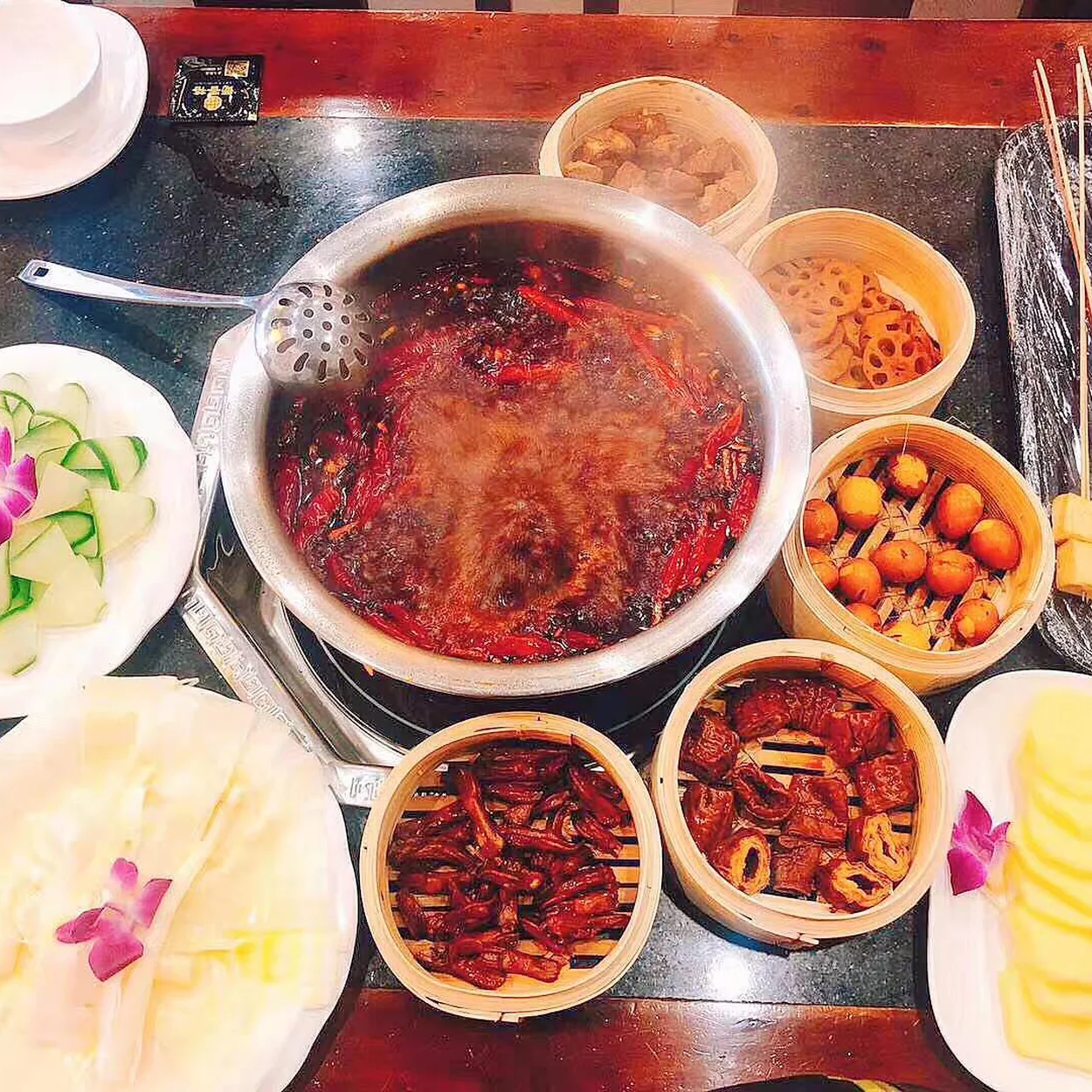 Hotpot spread with skewers, sides and dips at Shu Xiang Ge London