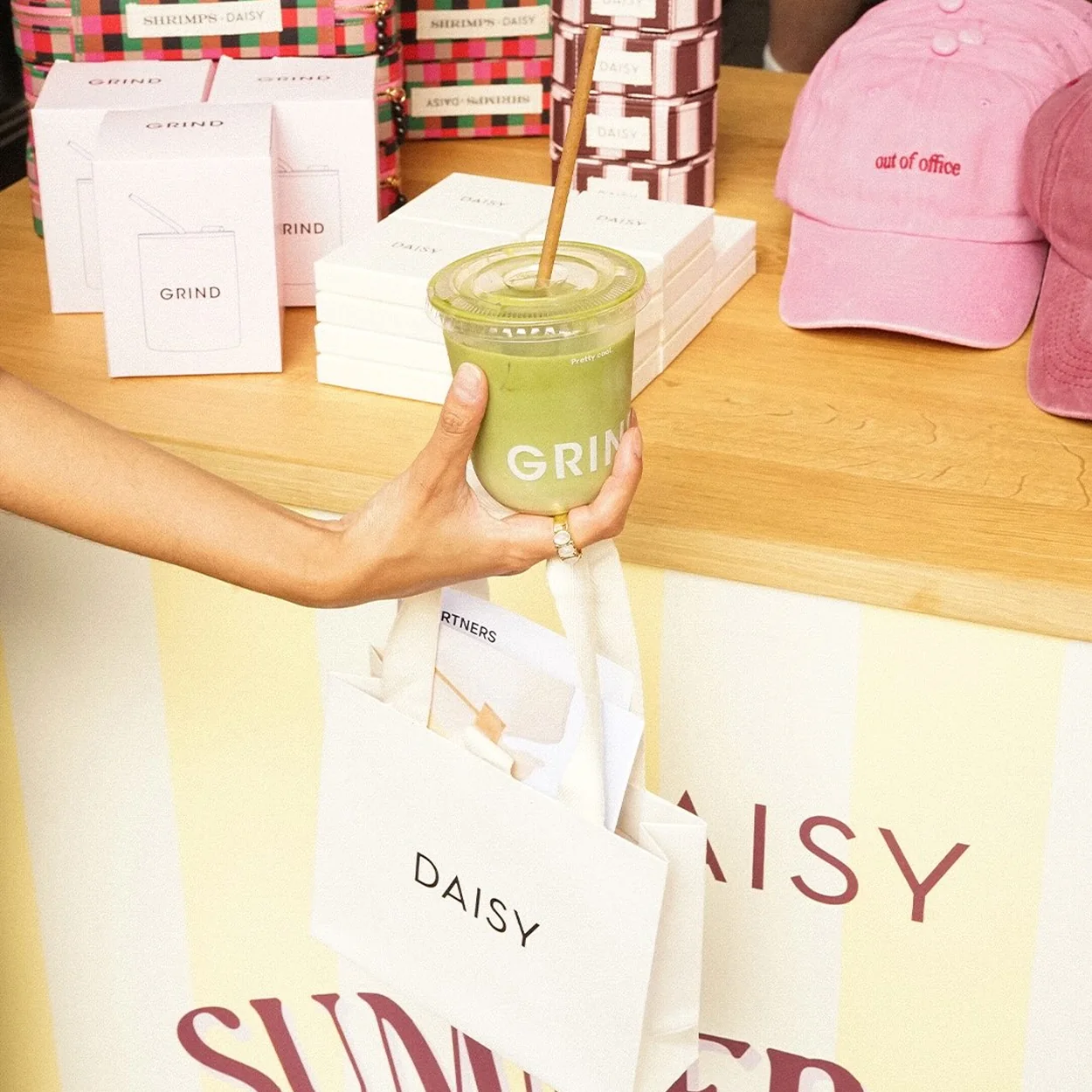 Iced matcha handed across the counter at Soho Grind on Beak Street