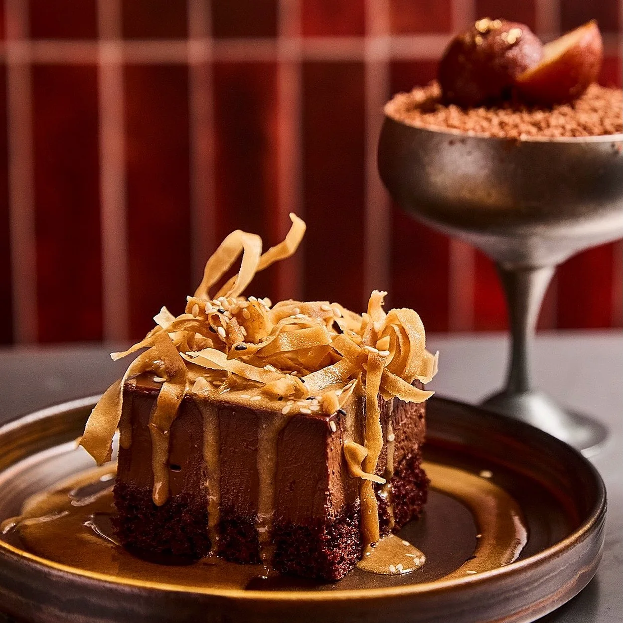 Sticky caramel dessert cake crowned with a gulab jamun at Tangra Soho