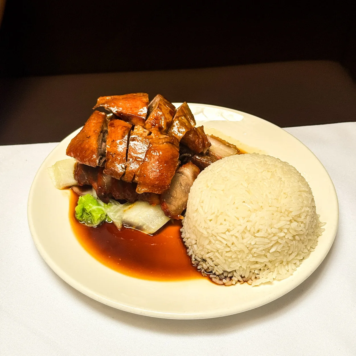 Roast pork belly with rice and greens at Tao Tao Ju in Chinatown