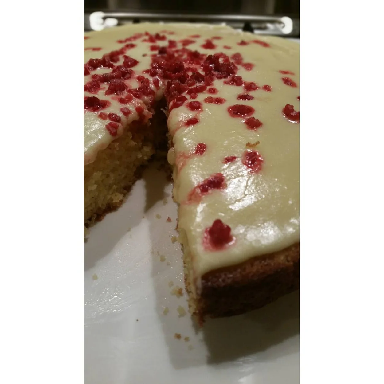 Iced sponge cake scattered with freeze-dried raspberries at Wonderful Patisserie