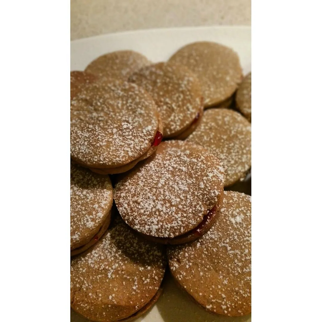 Sugar-dusted linzer biscuits sandwiched with jam at Wonderful Patisserie