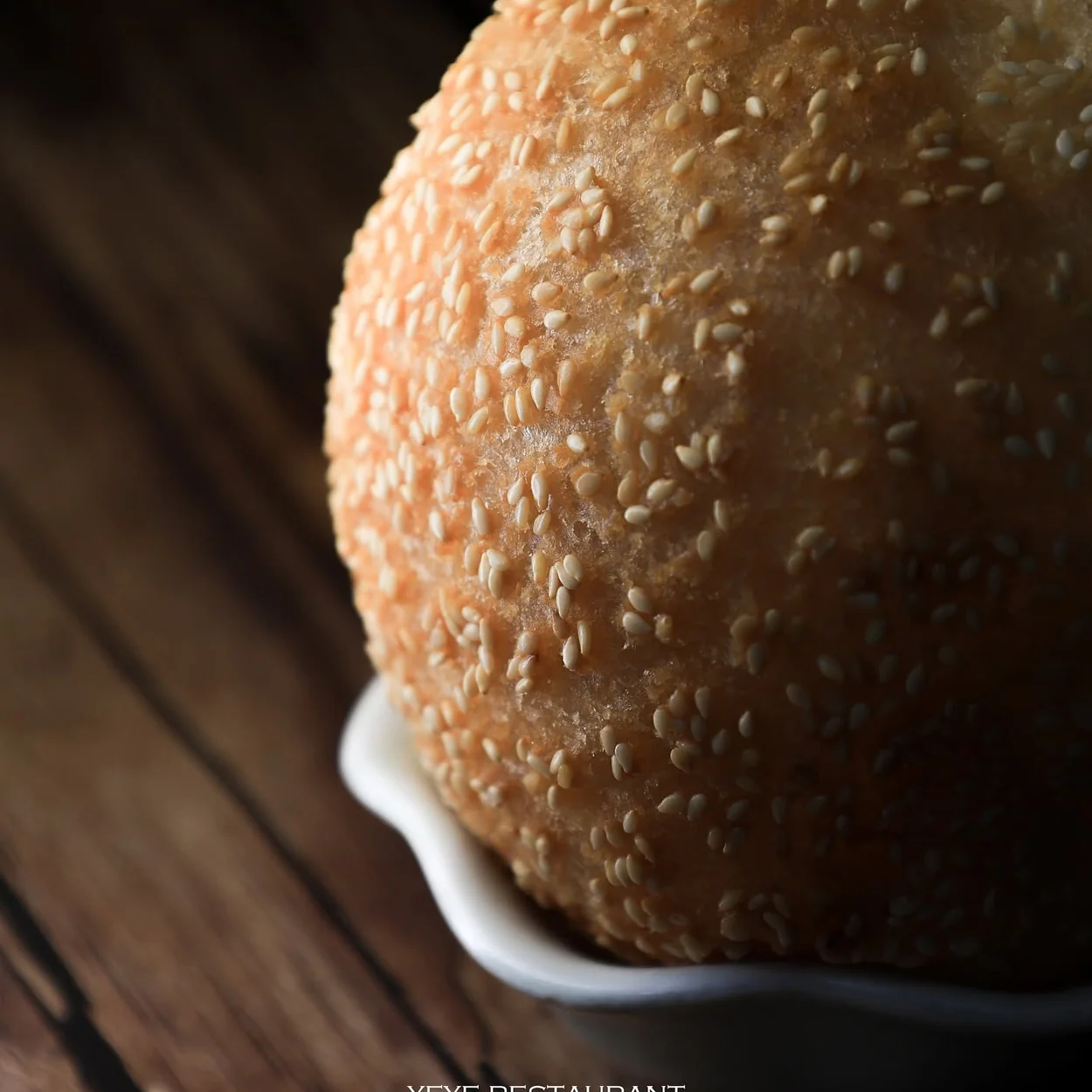 Golden sesame-crusted bun served at YeYe Noodle and Dumpling in Soho
