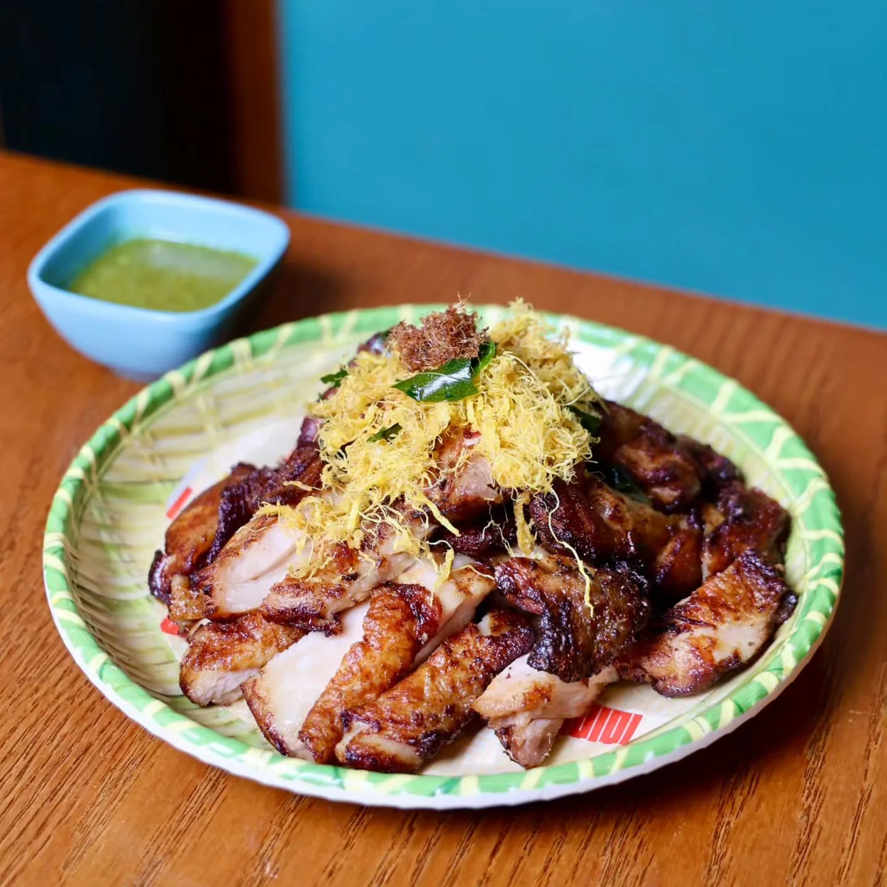 Roast meat platter with ginger relish on a patterned plate at Yiqi