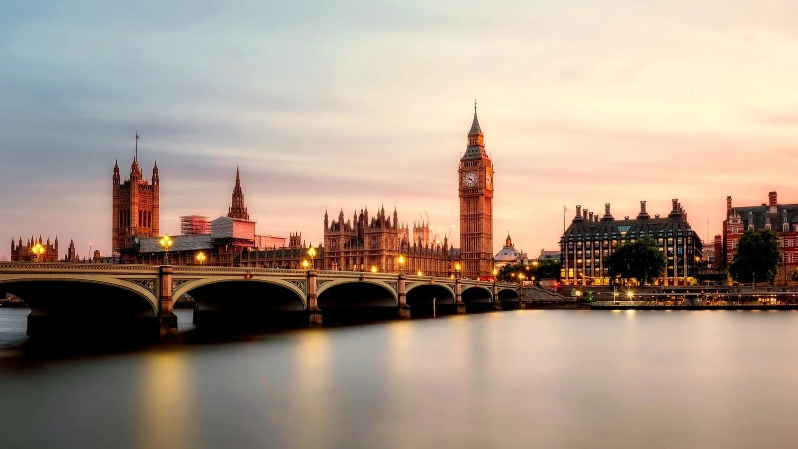 Westminster Bridge and Big Ben lit at dusk over the Thames, the start of an evening out in London